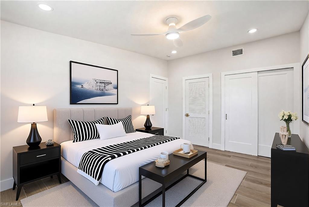 8336 Lagoon Road Fort Myers Beach, FL 33931 - Photo 15 of 50 This room features light-colored walls and wood-look flooring, complemented by recessed lighting and a ceiling fan - Virtually Edited Image