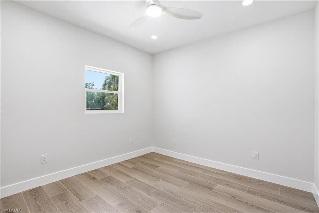 8336 Lagoon Road Fort Myers Beach, FL 33931 - Photo 19 of 50 The room features light wood-look flooring and a window providing natural light