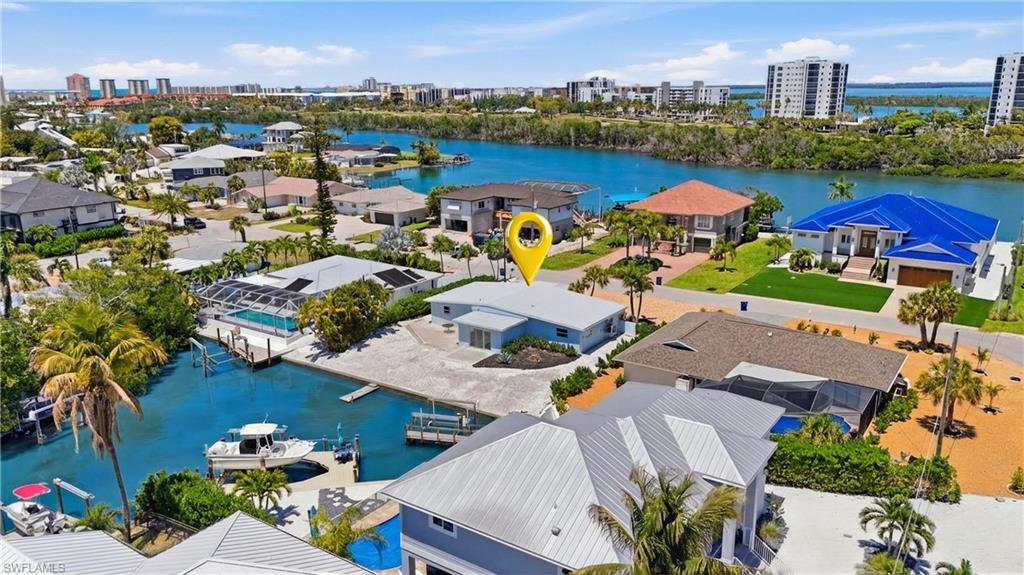8336 Lagoon Road Fort Myers Beach, FL 33931 - Photo 35 of 50 The property includes a private dock, providing direct water access - Virtually Edited Image