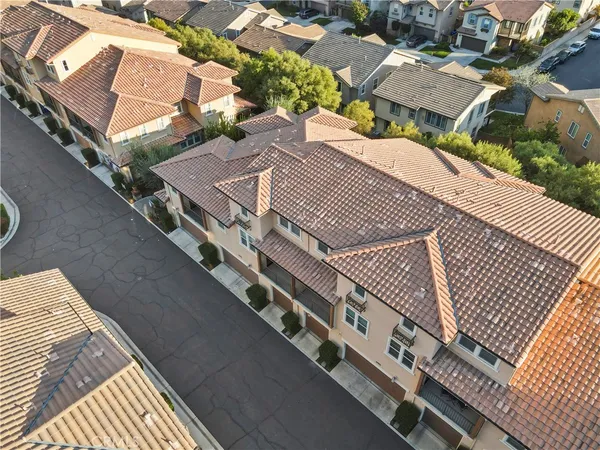 an aerial view of residential building and lake