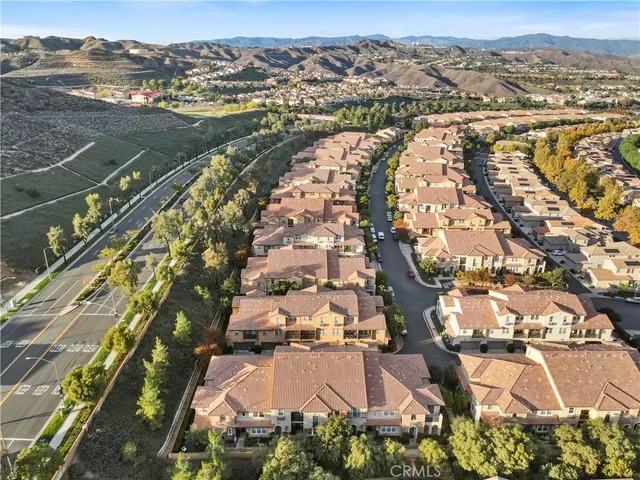 a view of a white building with many windows