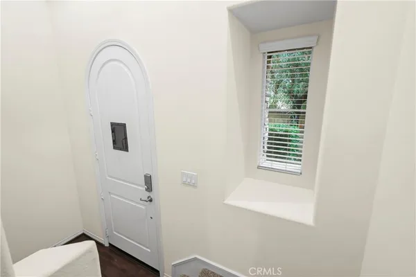 a view of a brick house with a large window