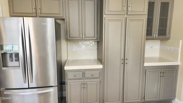 a white refrigerator freezer sitting inside of a kitchen