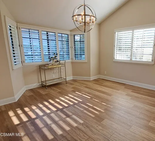a view of a room with a large window