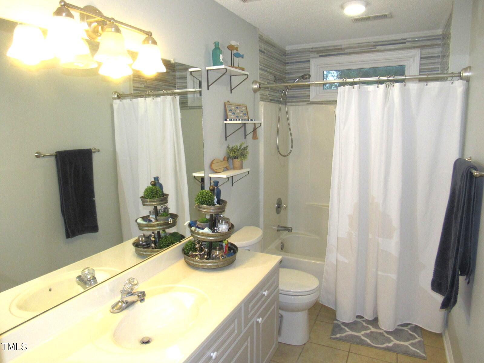 3214 Tump Wilkins Road Stem, NC 27581 - Photo 37 of 90 Guest bath