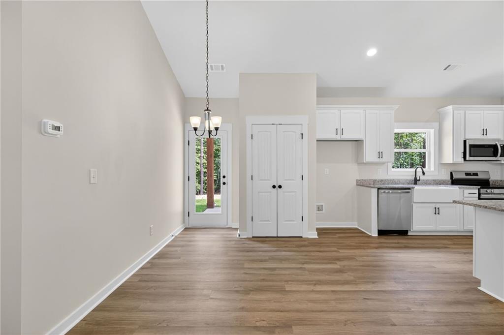 5534 Steadman Road Buchanan, GA 30113 - Photo 12 of 40 a view of cabinets and wooden floor