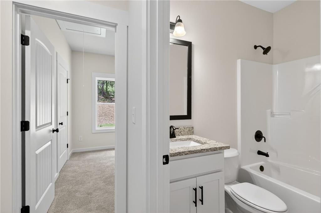 5534 Steadman Road Buchanan, GA 30113 - Photo 27 of 40 a bathroom with a sink a toilet and shower