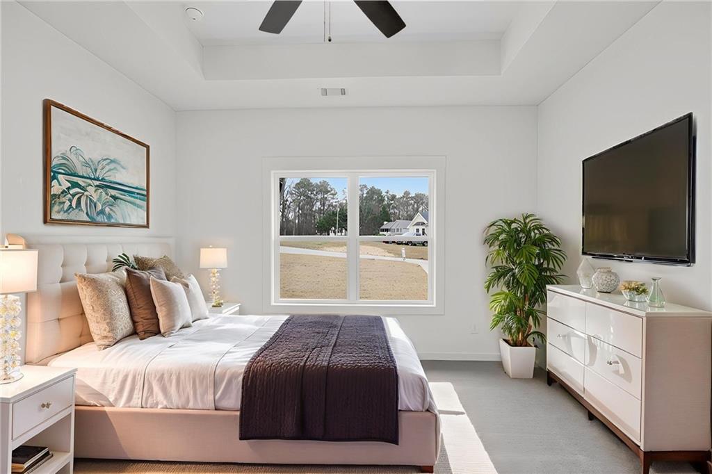 5534 Steadman Road Buchanan, GA 30113 - Photo 6 of 40 a bedroom with a large bed and a flat screen tv