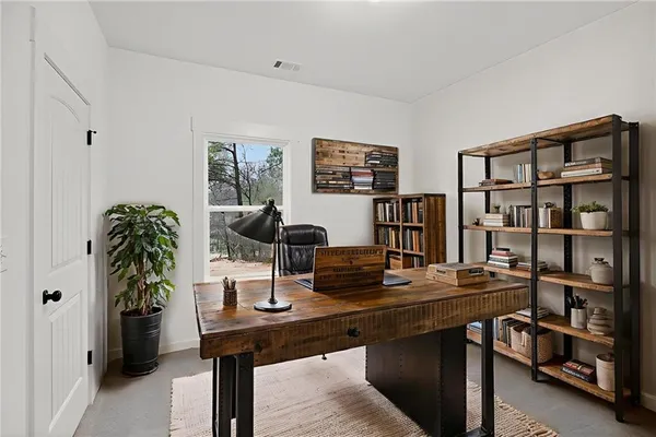 a view of a workspace with furniture