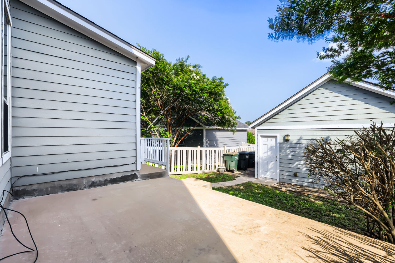 5136 Hellman Kyle, TX 78640 - Photo 24 of 25 a front view of a house with a garden