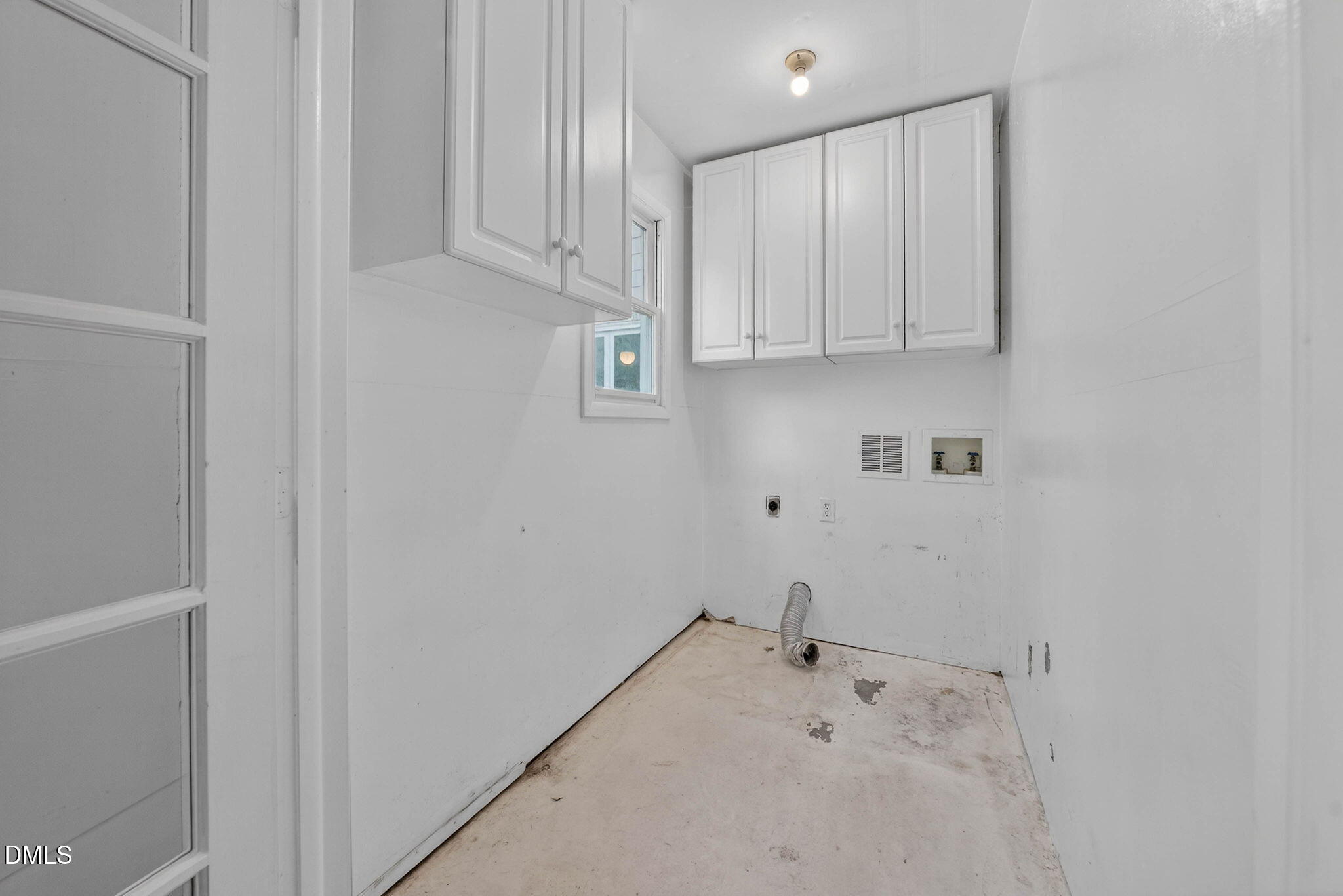 11617 Coachmans Way Raleigh, NC 27614 - Photo 48 of 79 The laundry room is off of the unfinished room and overlooks the back yard.