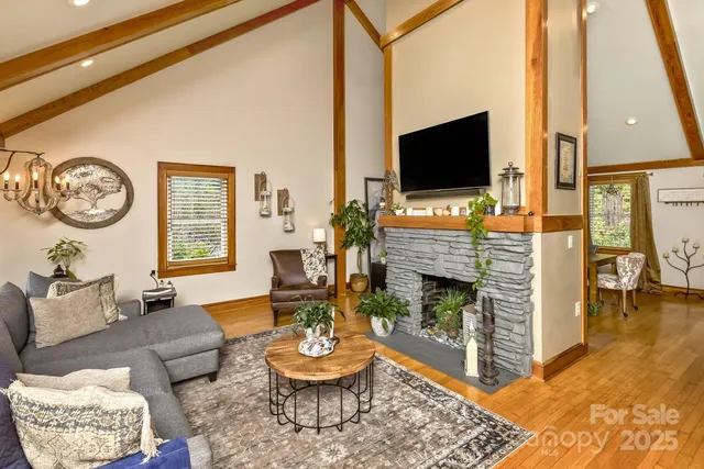 a view of a room with furniture and wooden floor