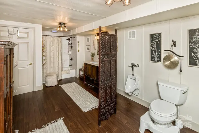 a bedroom with furniture and a window