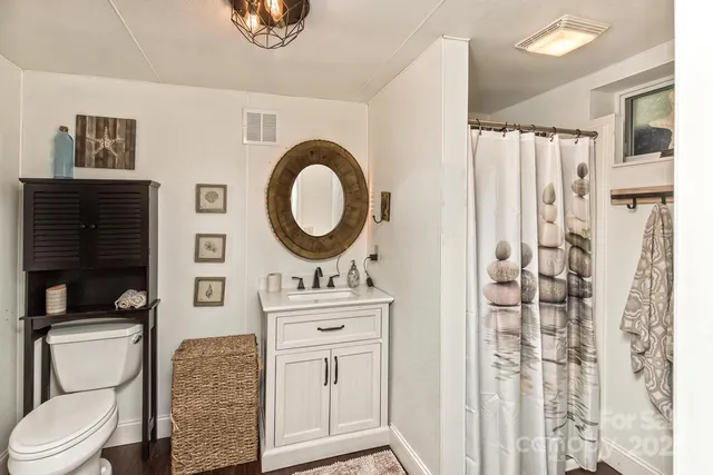 a kitchen with a refrigerator and cabinets