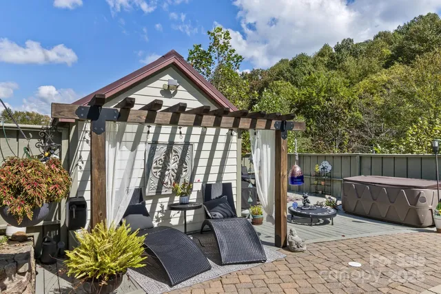 a view of a chairs and table in backyard