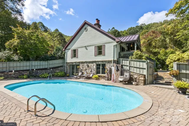 a view of a swimming pool with a lounge chairs