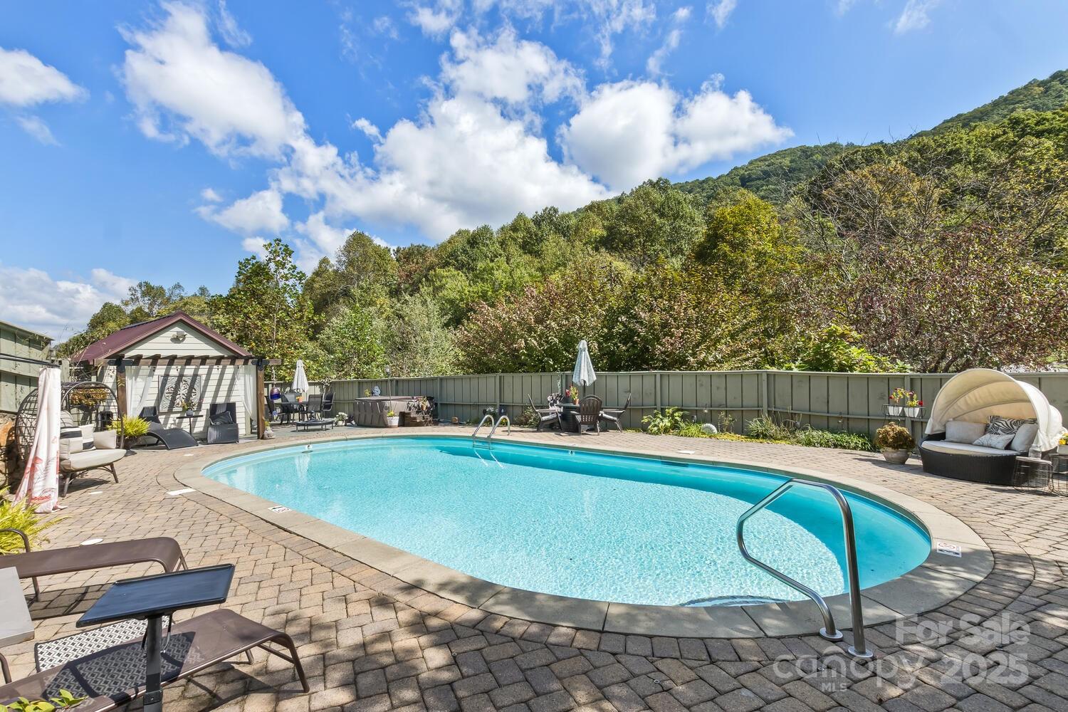 25 View Ridge Parkway Leicester, NC 28748 - Photo 33 of 47 a view of a swimming pool with a lounge chairs