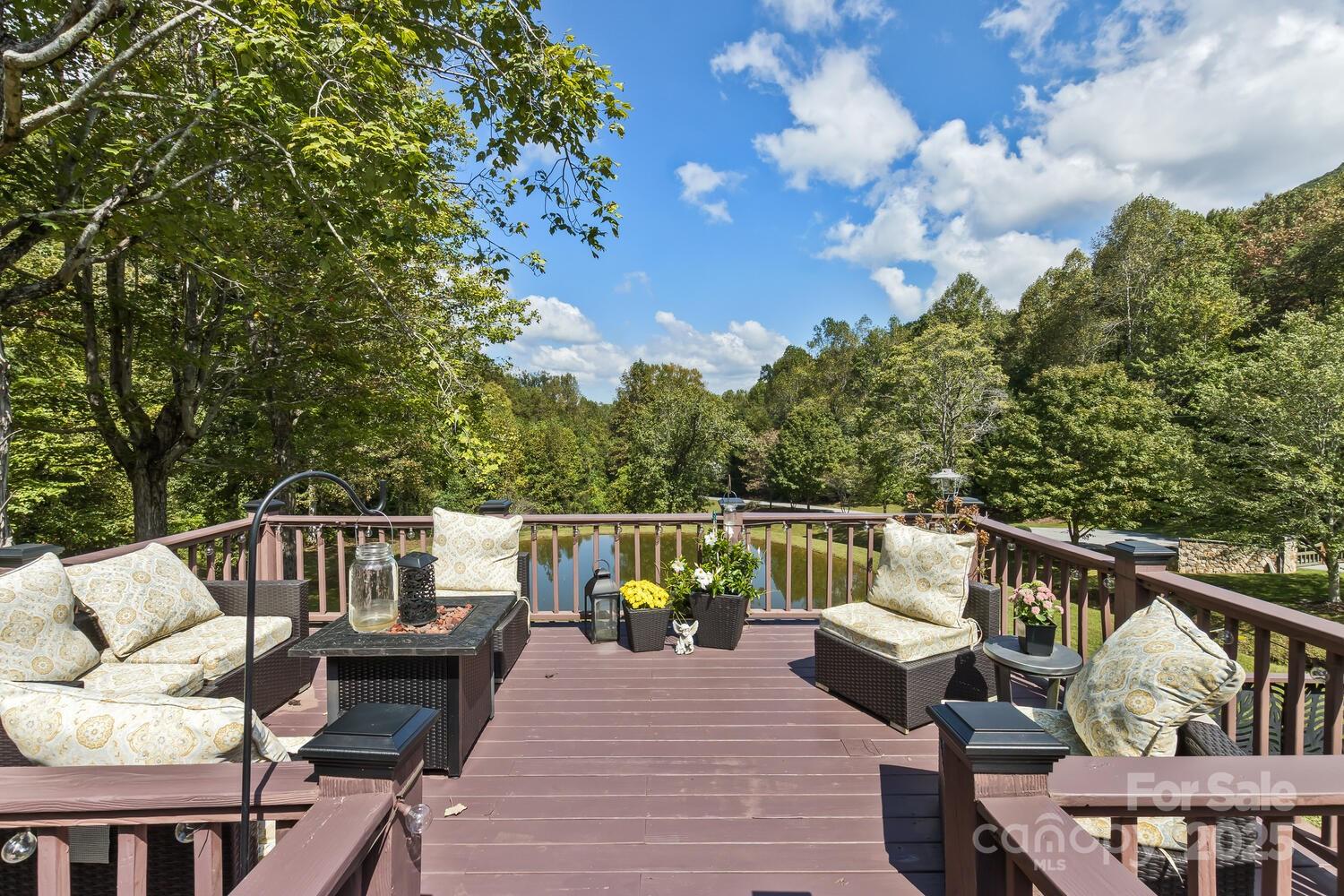 25 View Ridge Parkway Leicester, NC 28748 - Photo 34 of 47 a balcony with wooden floor and furniture