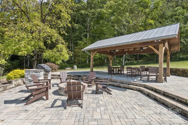 a view of a chairs and table in the patio