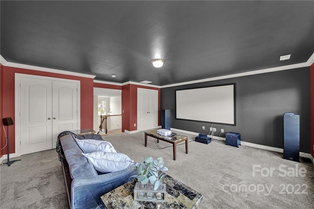 1557 Hazel Street Tega Cay, SC 29708 - Photo 39 of 47 a room with furniture projector and screen