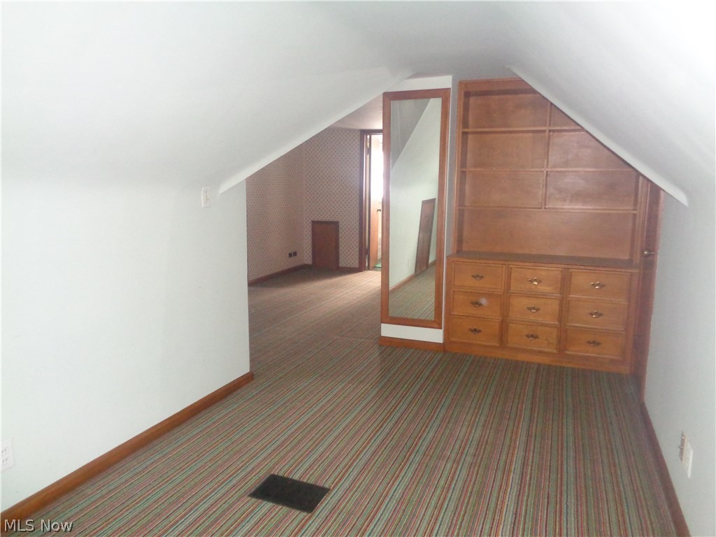 4398 West Anderson Road Cleveland, OH 44121 - Photo 24 of 33 Second bedroom on second floor with built-in dresser and bookcase and full length mirror.