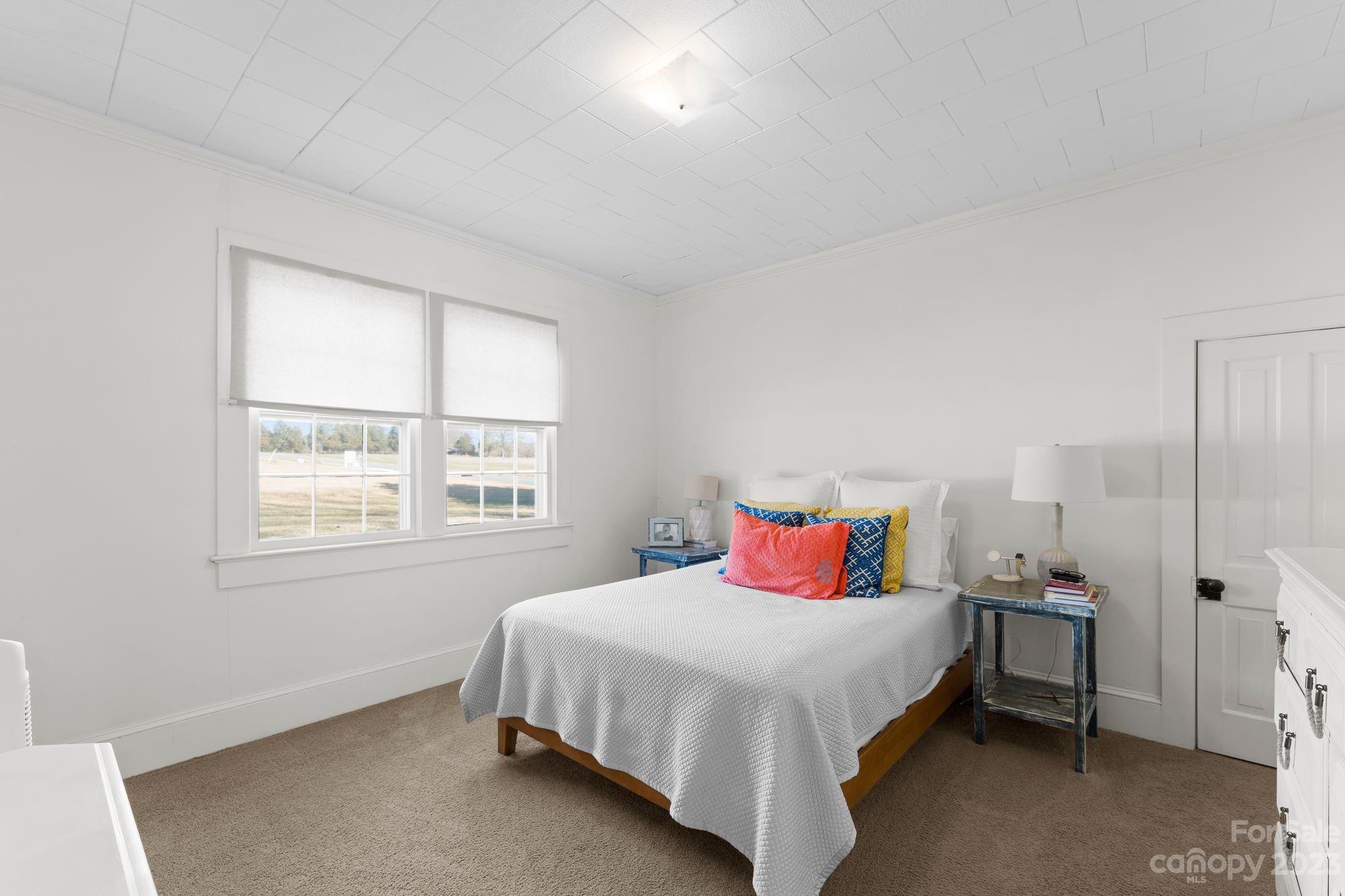 4121 Windy Road Concord, NC 28027 - Photo 13 of 22 a bedroom with a bed and window