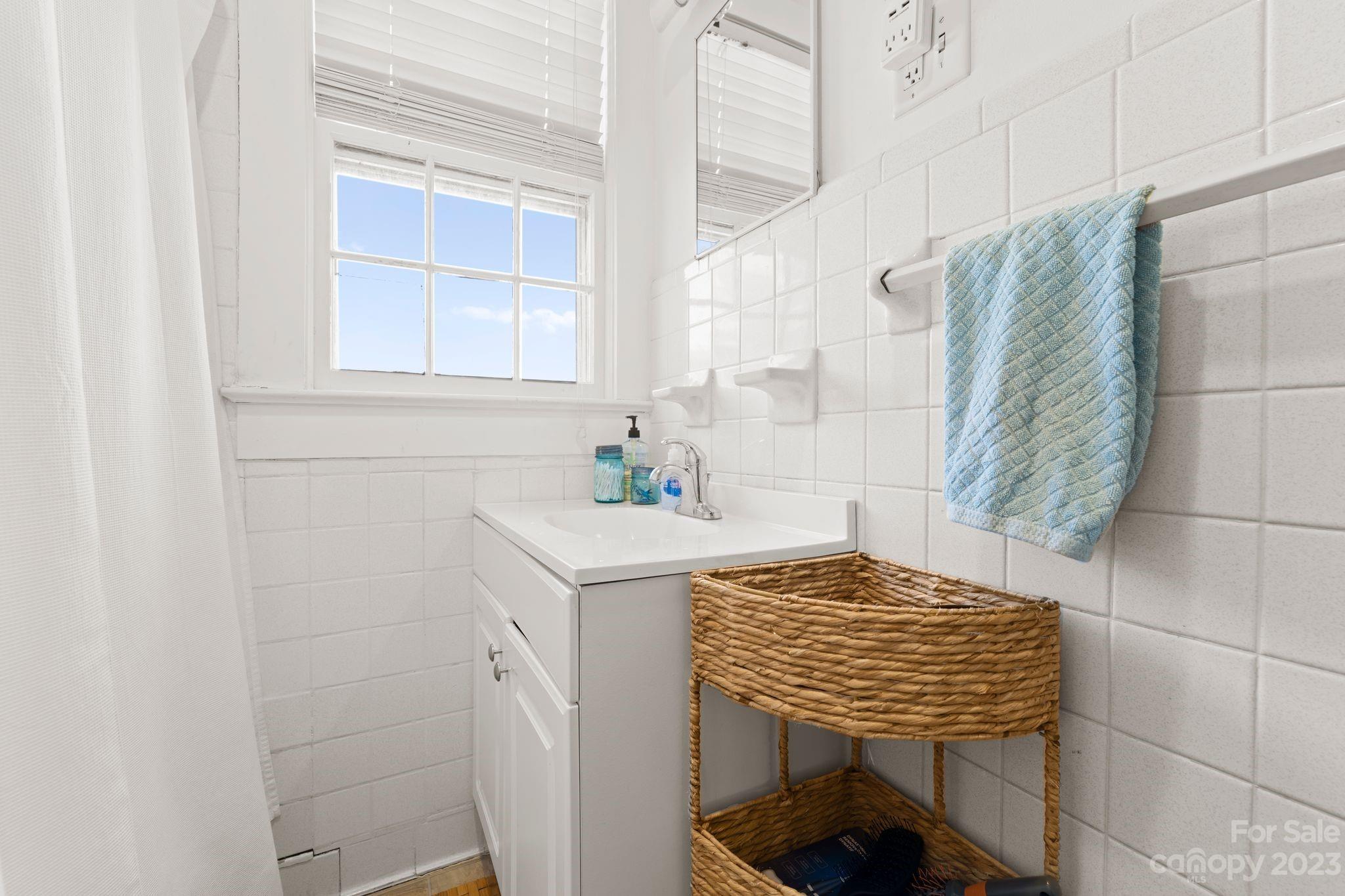 4121 Windy Road Concord, NC 28027 - Photo 14 of 22 a bathroom with a sink and a window