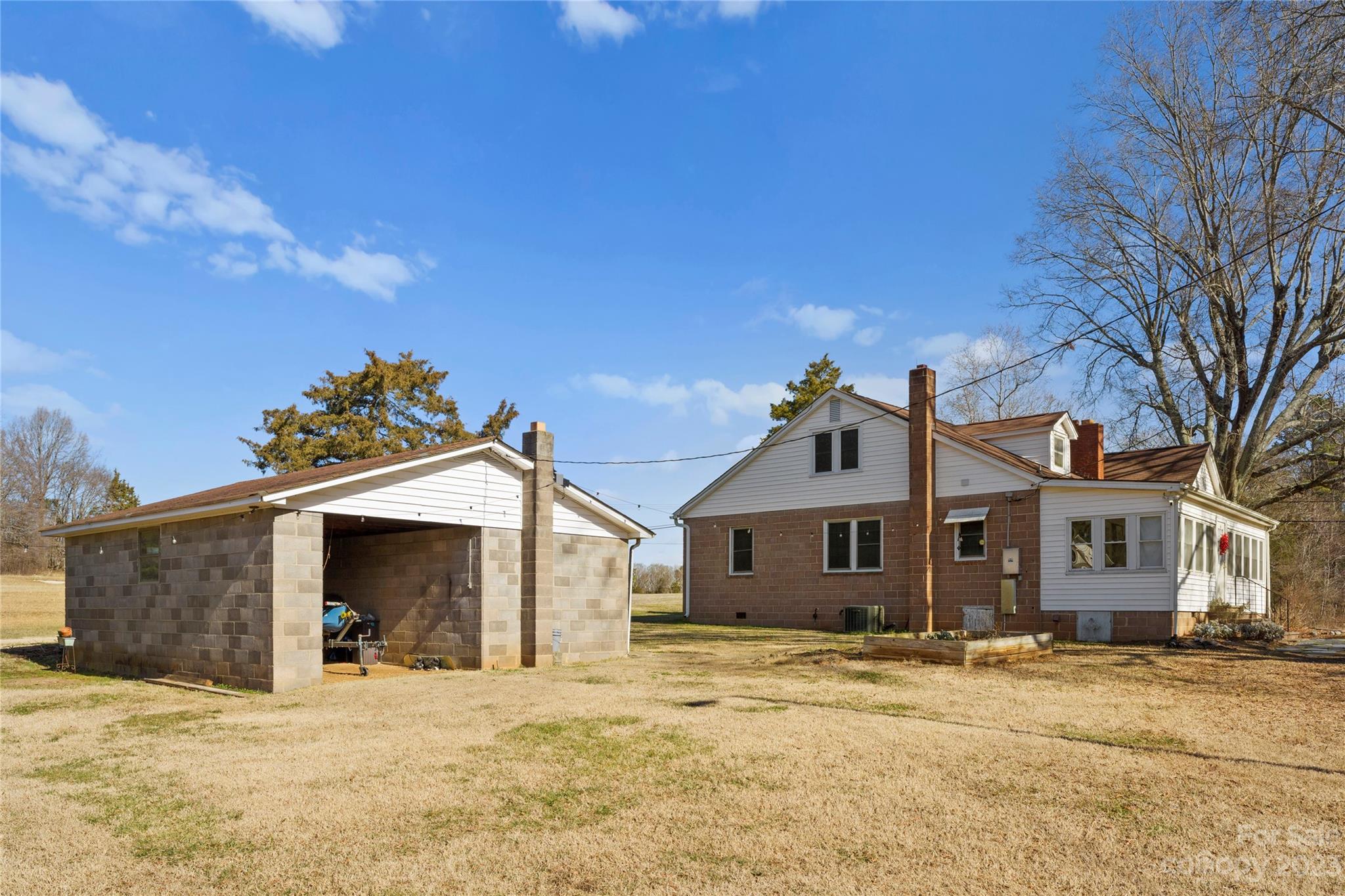 4121 Windy Road Concord, NC 28027 - Photo 20 of 22 a front view of a house with a snow yard