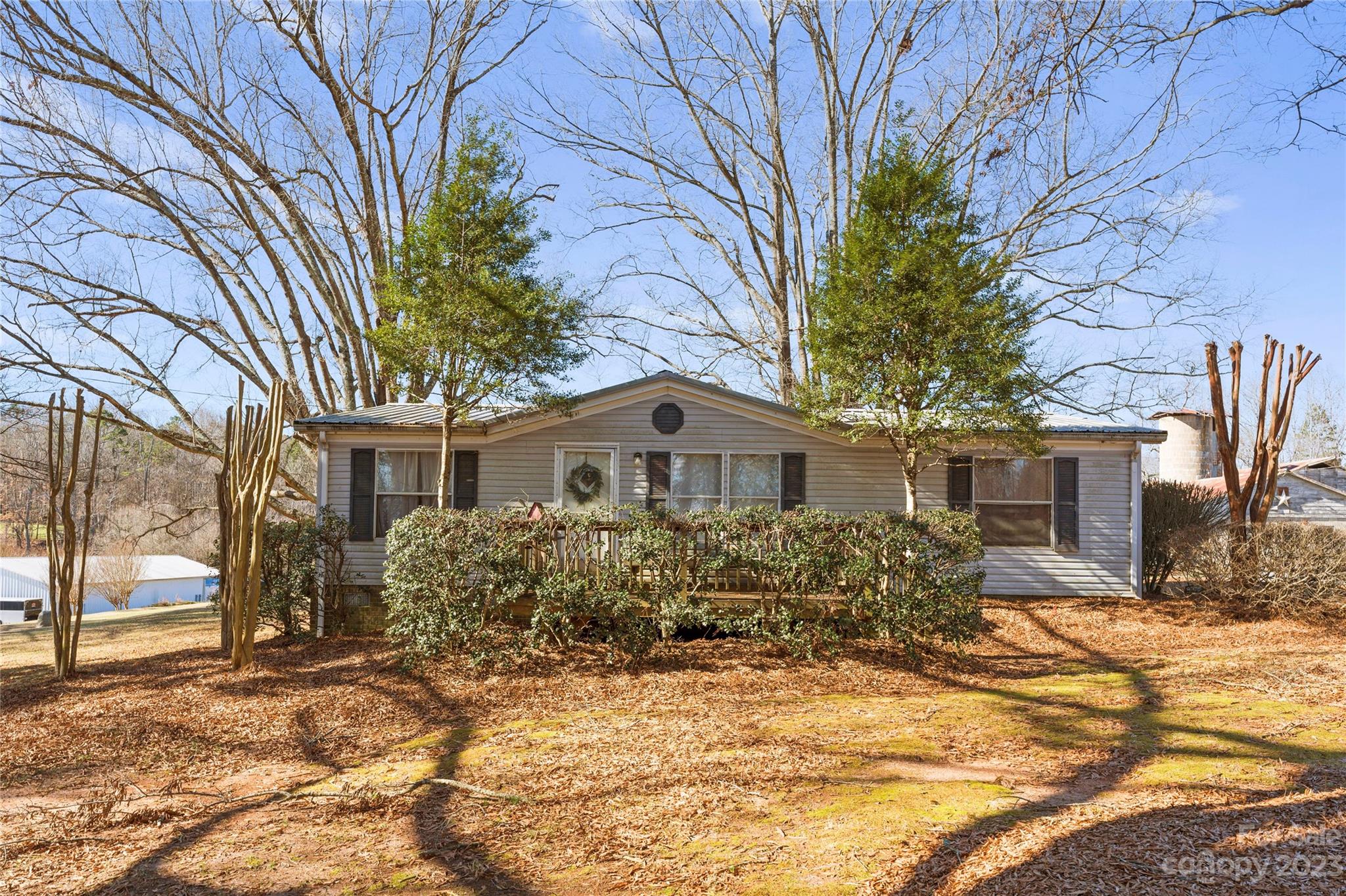 4121 Windy Road Concord, NC 28027 - Photo 21 of 22 a front view of a house with a yard and garage