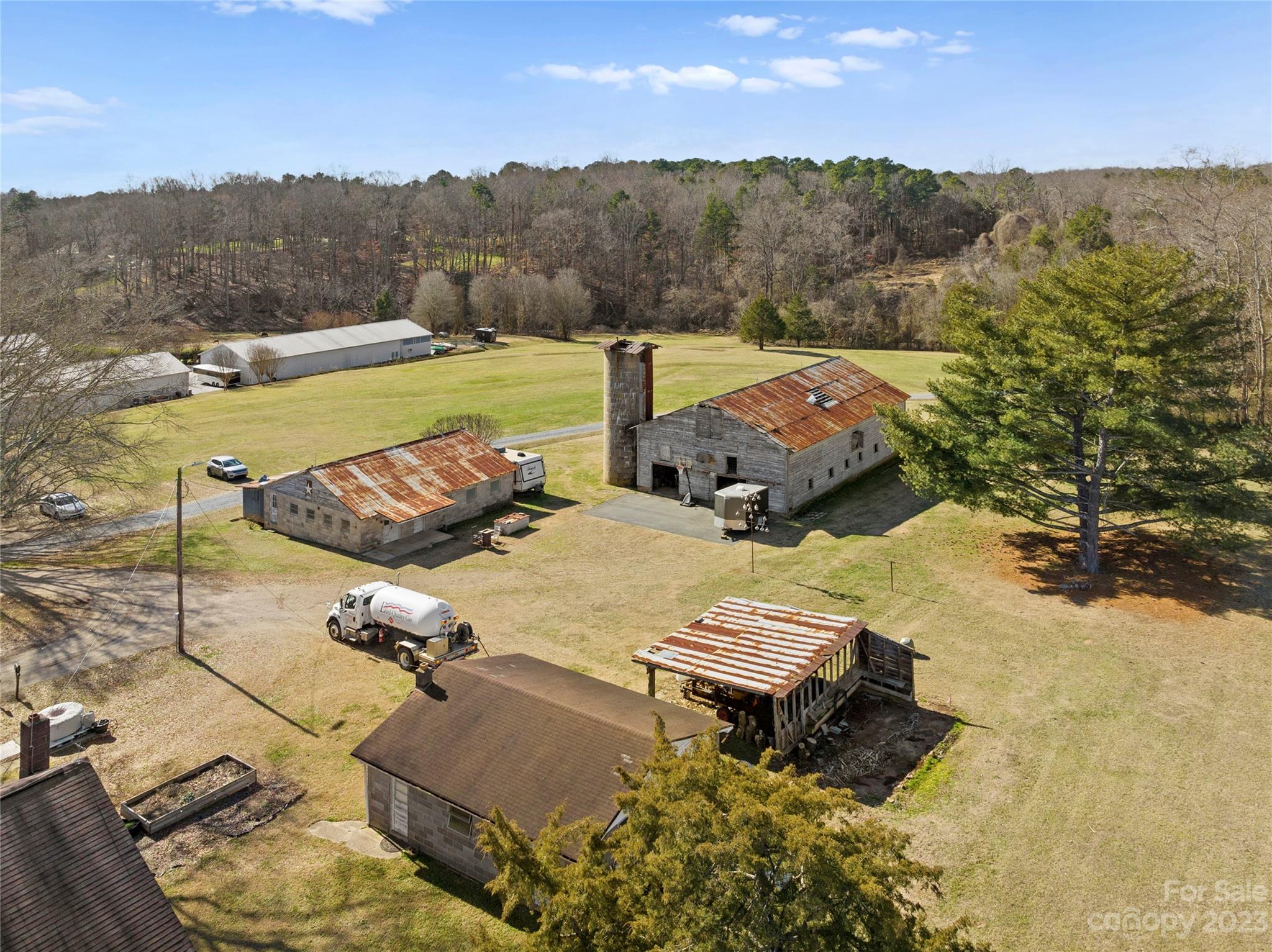 4121 Windy Road Concord, NC 28027 - Photo 22 of 22 an aerial view of a house with pool and mountain view
