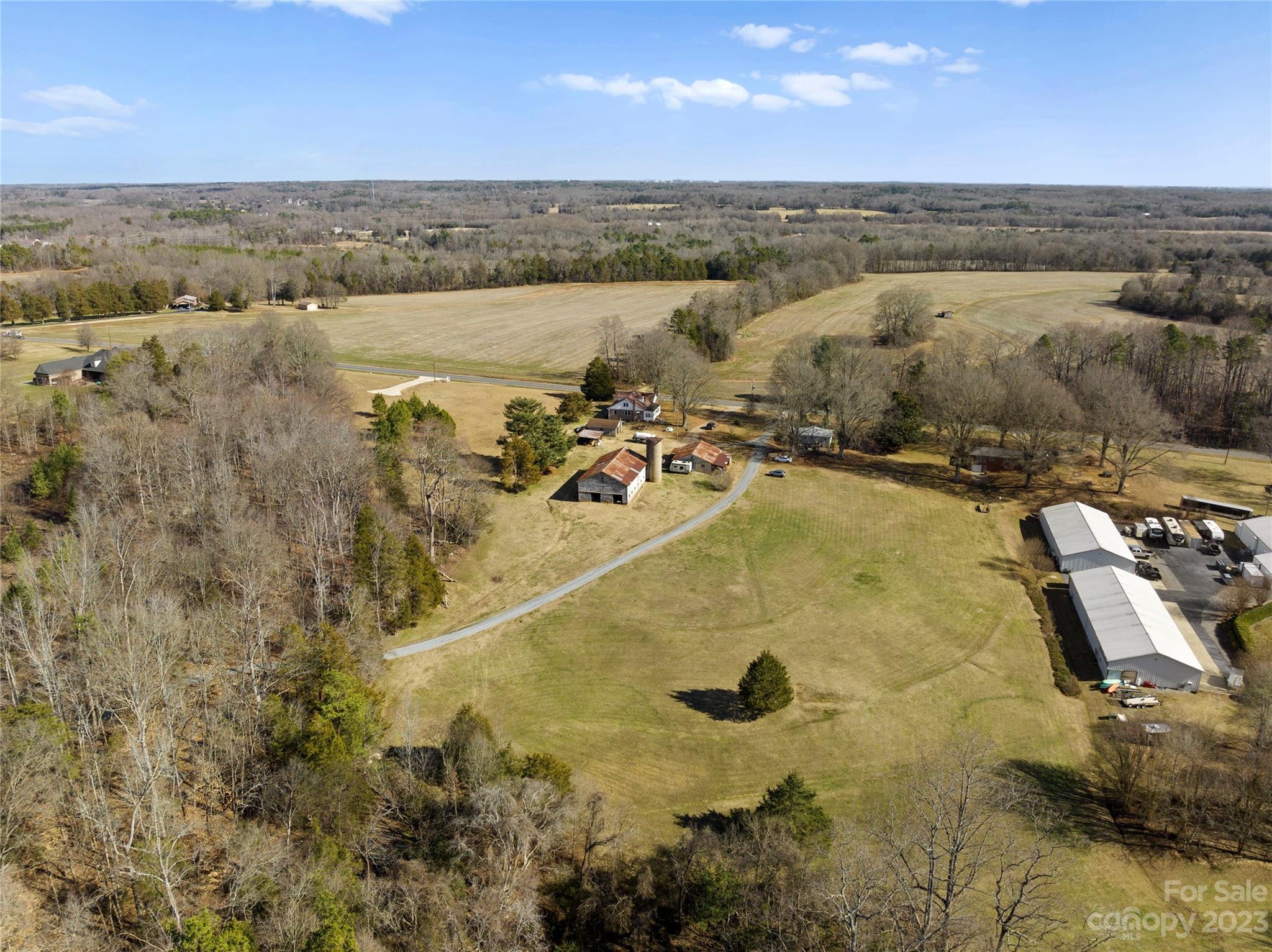 4121 Windy Road Concord, NC 28027 - Photo 4 of 22 an aerial view of residential houses with outdoor space