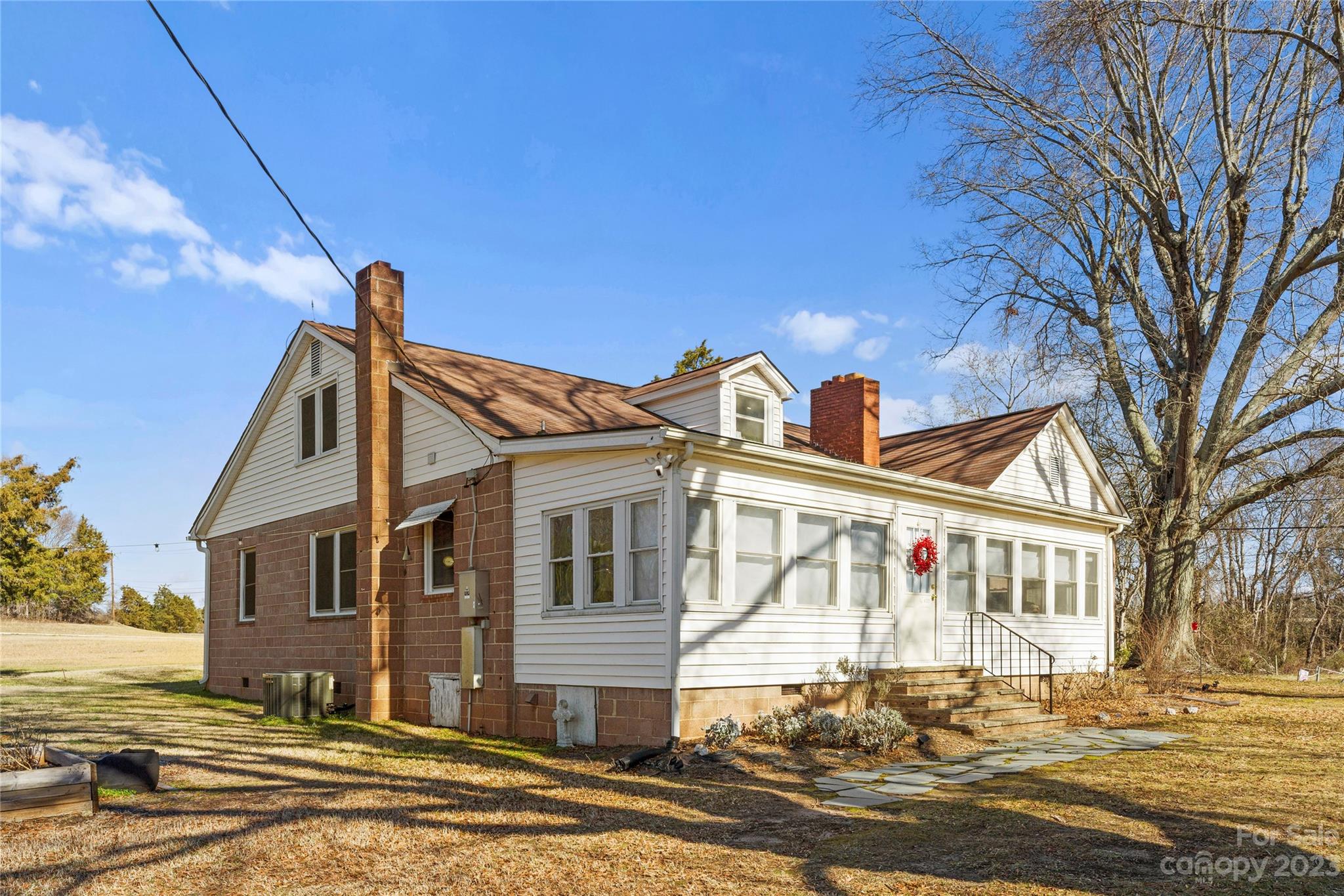 4121 Windy Road Concord, NC 28027 - Photo 7 of 22 a front view of a house with a road