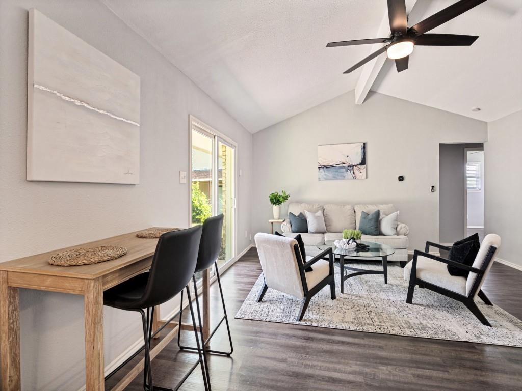 1405 Rambler Road Arlington, TX 76014 - Photo 9 of 26 Vaulted ceilings complement the open-concept living area with wood-finish flooring