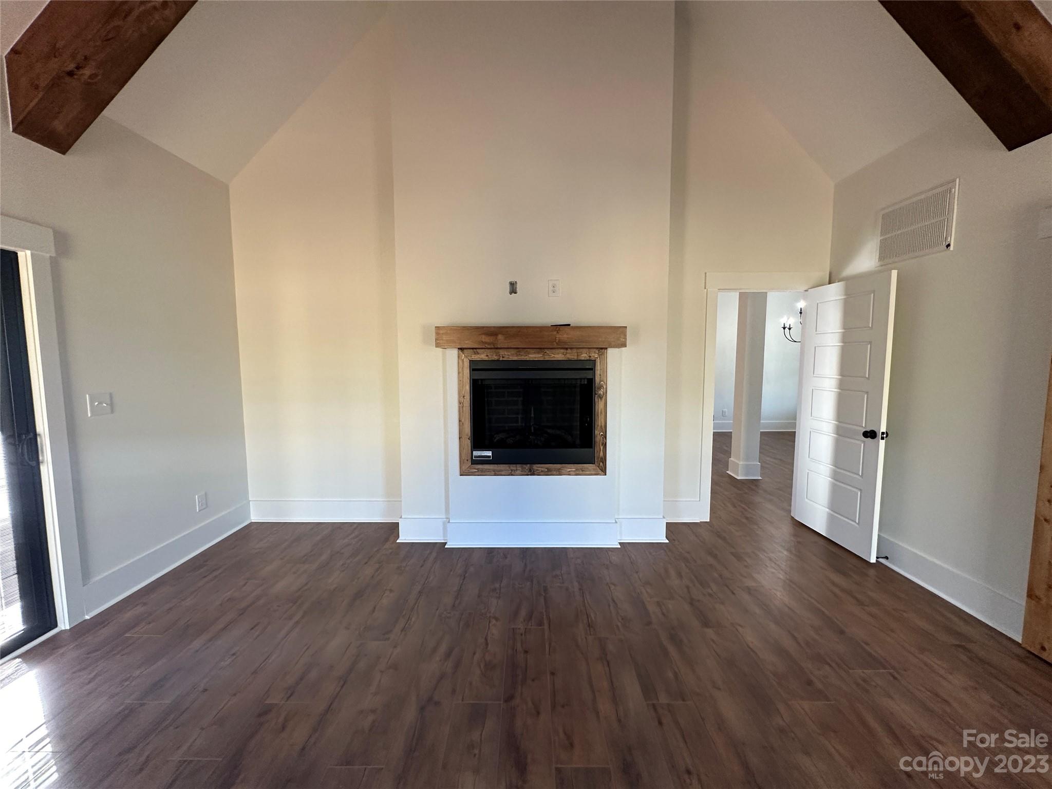 208 Beth Haven Church Road Denver, NC 28037 - Photo 11 of 29 a view of a livingroom with wooden floor and a fireplace