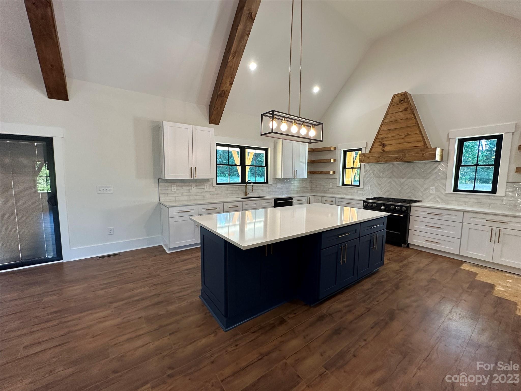 208 Beth Haven Church Road Denver, NC 28037 - Photo 17 of 29 a kitchen with a sink and a stove top oven