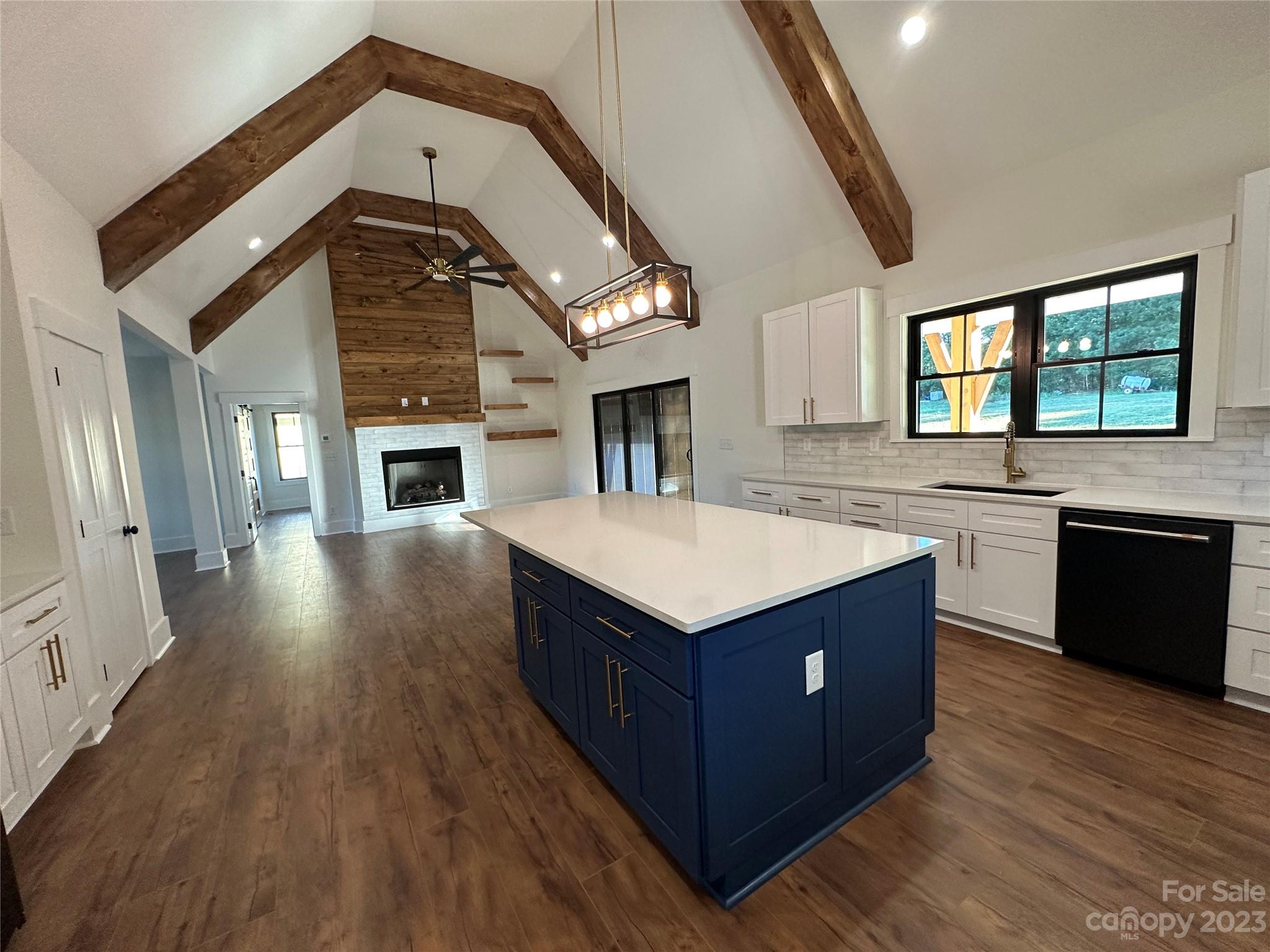 208 Beth Haven Church Road Denver, NC 28037 - Photo 19 of 29 a kitchen with stainless steel appliances granite countertop a stove and a wooden floors