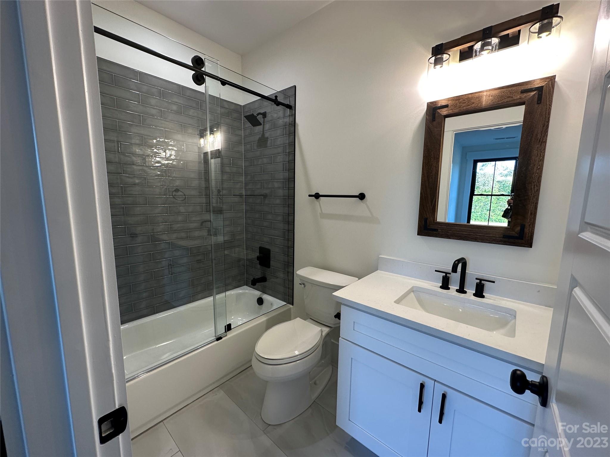 208 Beth Haven Church Road Denver, NC 28037 - Photo 22 of 29 a bathroom with a sink a toilet and shower