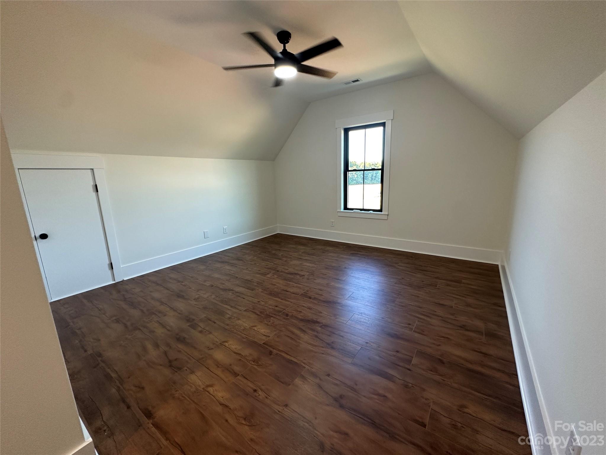 208 Beth Haven Church Road Denver, NC 28037 - Photo 24 of 29 an empty room with wooden floor fan and windows