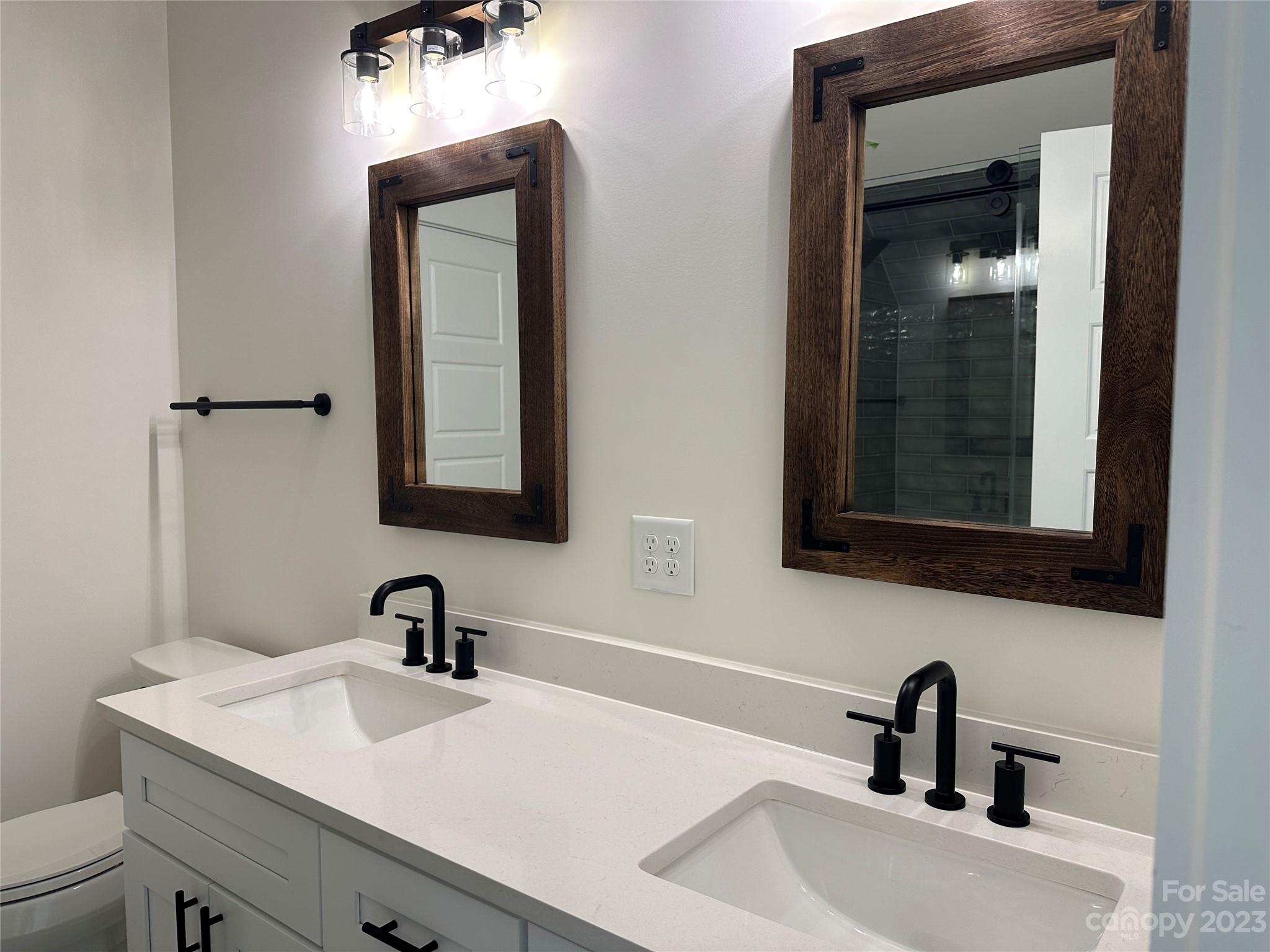 208 Beth Haven Church Road Denver, NC 28037 - Photo 26 of 29 a bathroom with a sink and mirror