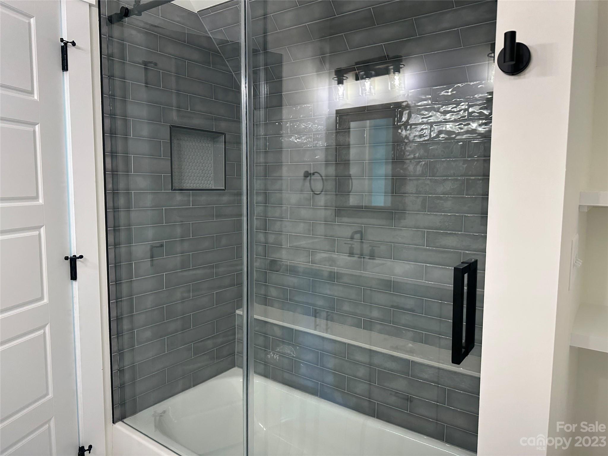 208 Beth Haven Church Road Denver, NC 28037 - Photo 27 of 29 a bathroom with a glass shower door