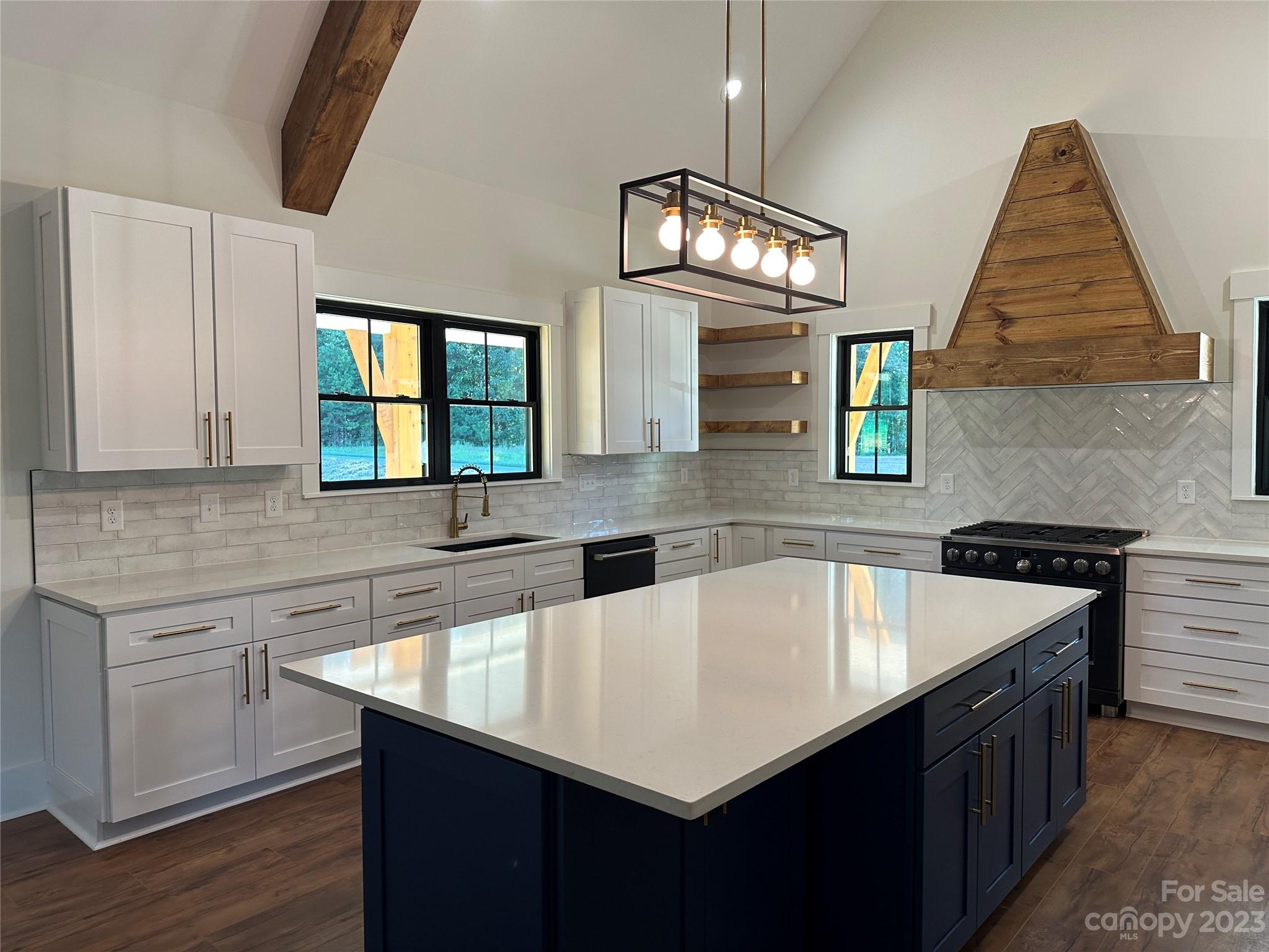 208 Beth Haven Church Road Denver, NC 28037 - Photo 7 of 29 a kitchen with a sink dishwasher and a stove with wooden floor