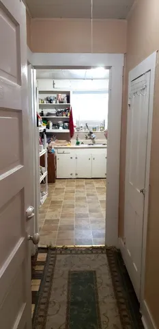 a view of kitchen with wooden floor
