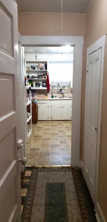 a view of kitchen with wooden floor