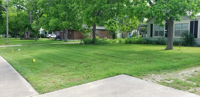 a backyard of a house with lots of green space