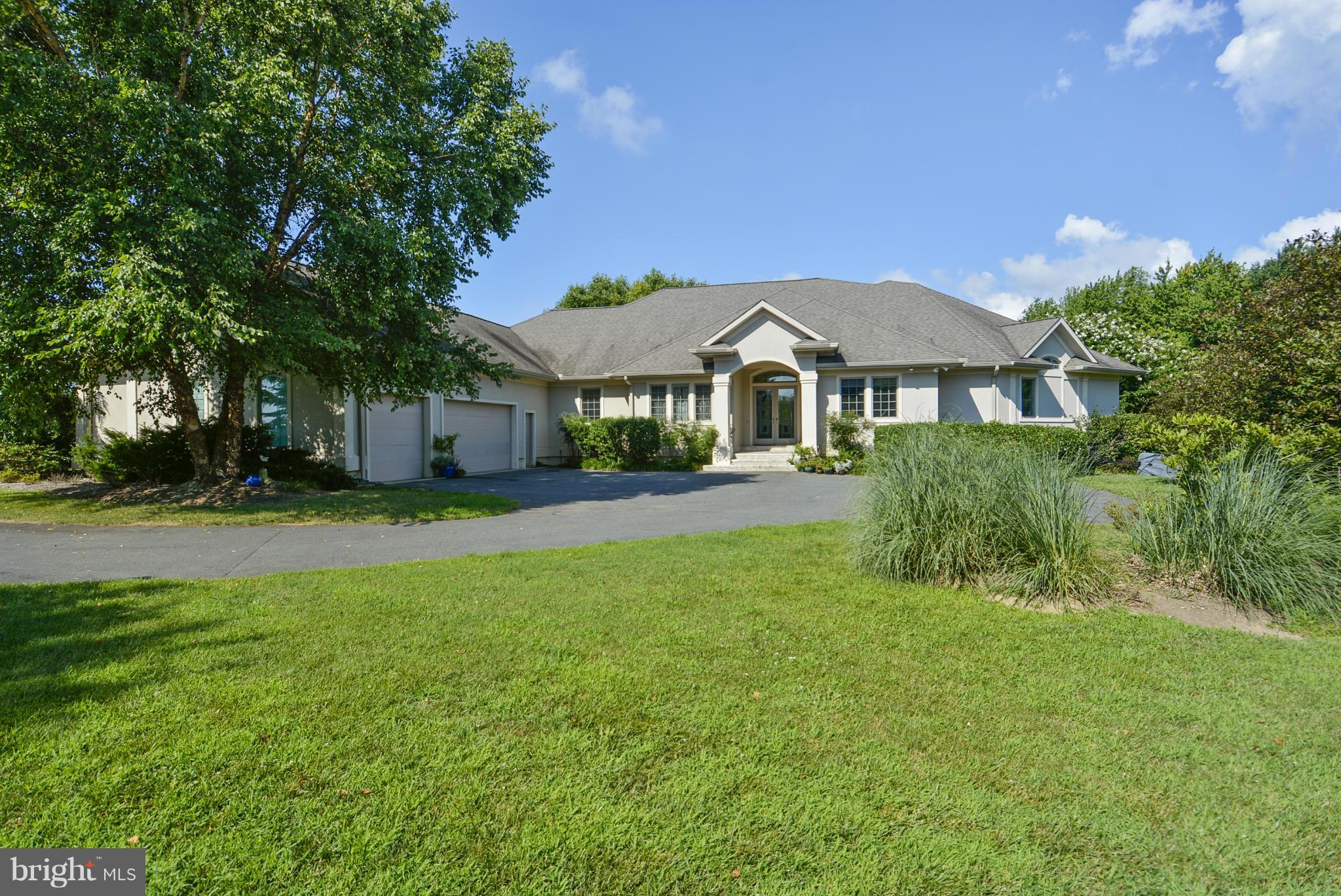 1690 Cox Neck Road Chester, MD 21619 - Photo 28 of 28 a front view of a house with a yard