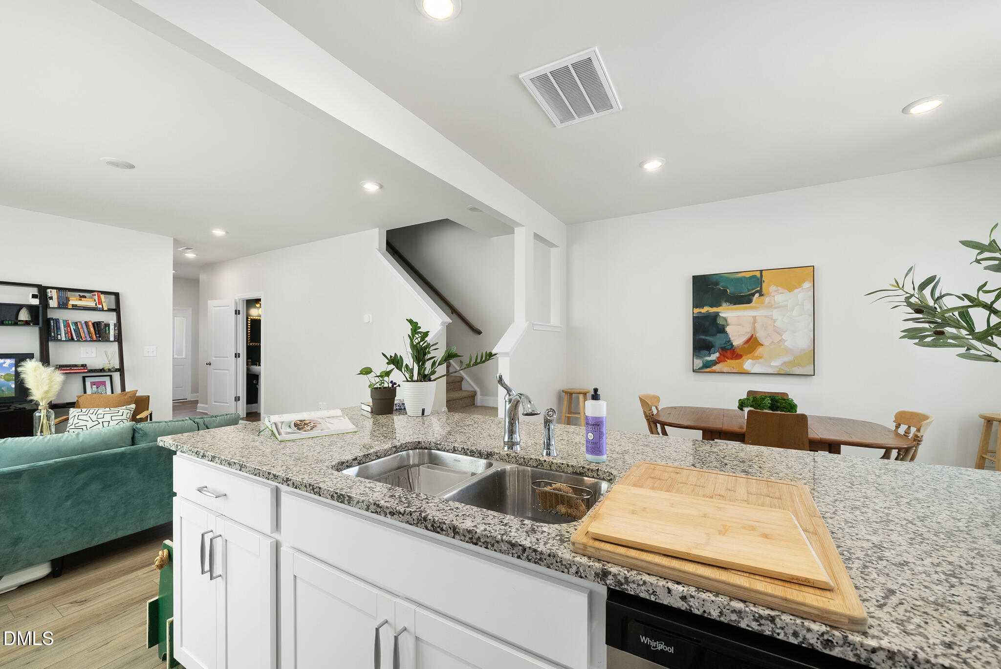 53 Bibury Way Angier, NC 27501 - Photo 15 of 50 a kitchen with a sink and a living room view