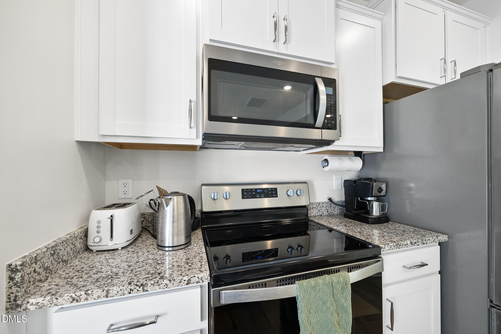 53 Bibury Way Angier, NC 27501 - Photo 16 of 50 a kitchen with a stove and a microwave