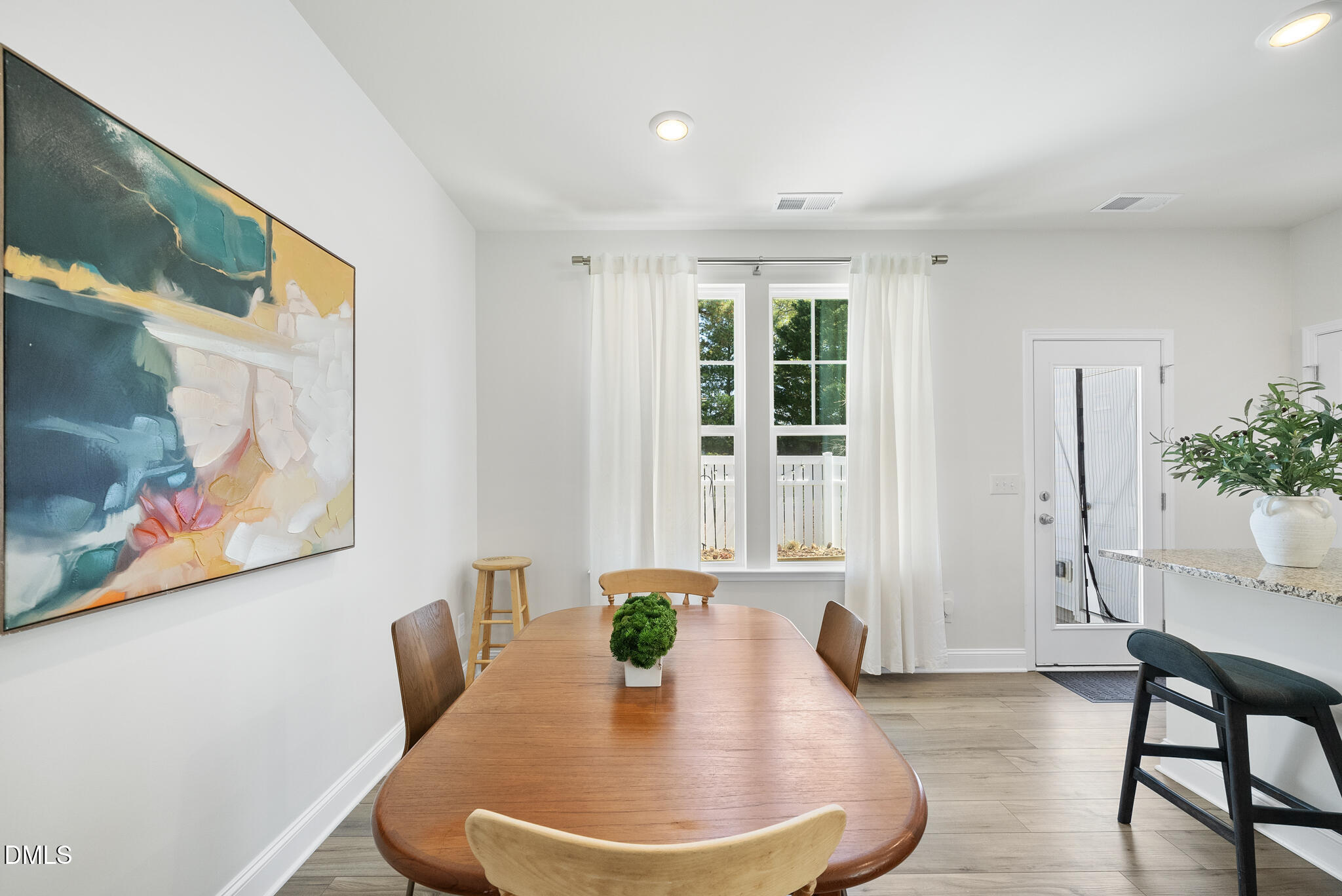 53 Bibury Way Angier, NC 27501 - Photo 18 of 50 a dining room with furniture and wooden floor