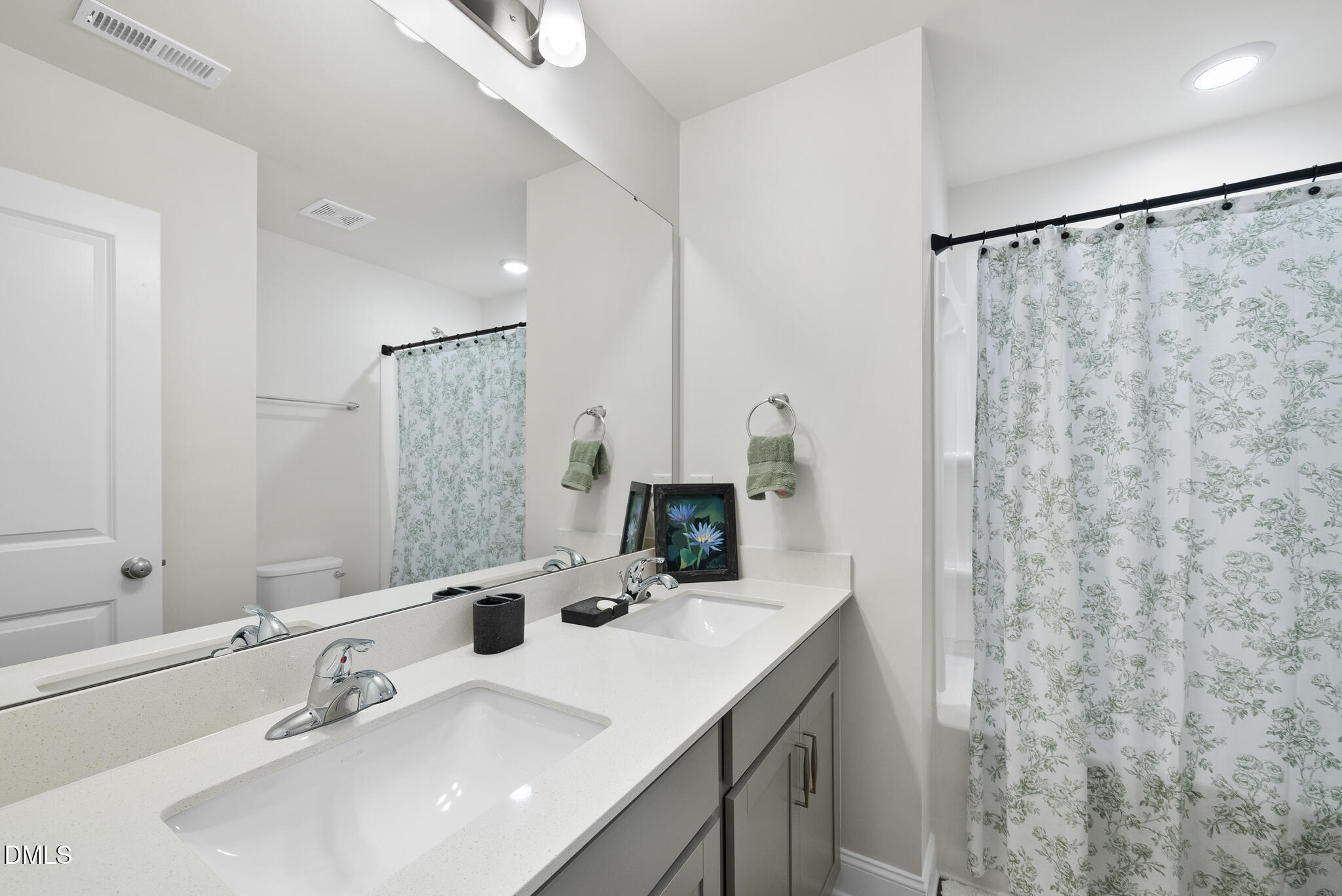 53 Bibury Way Angier, NC 27501 - Photo 19 of 50 a bathroom with a sink and a mirror