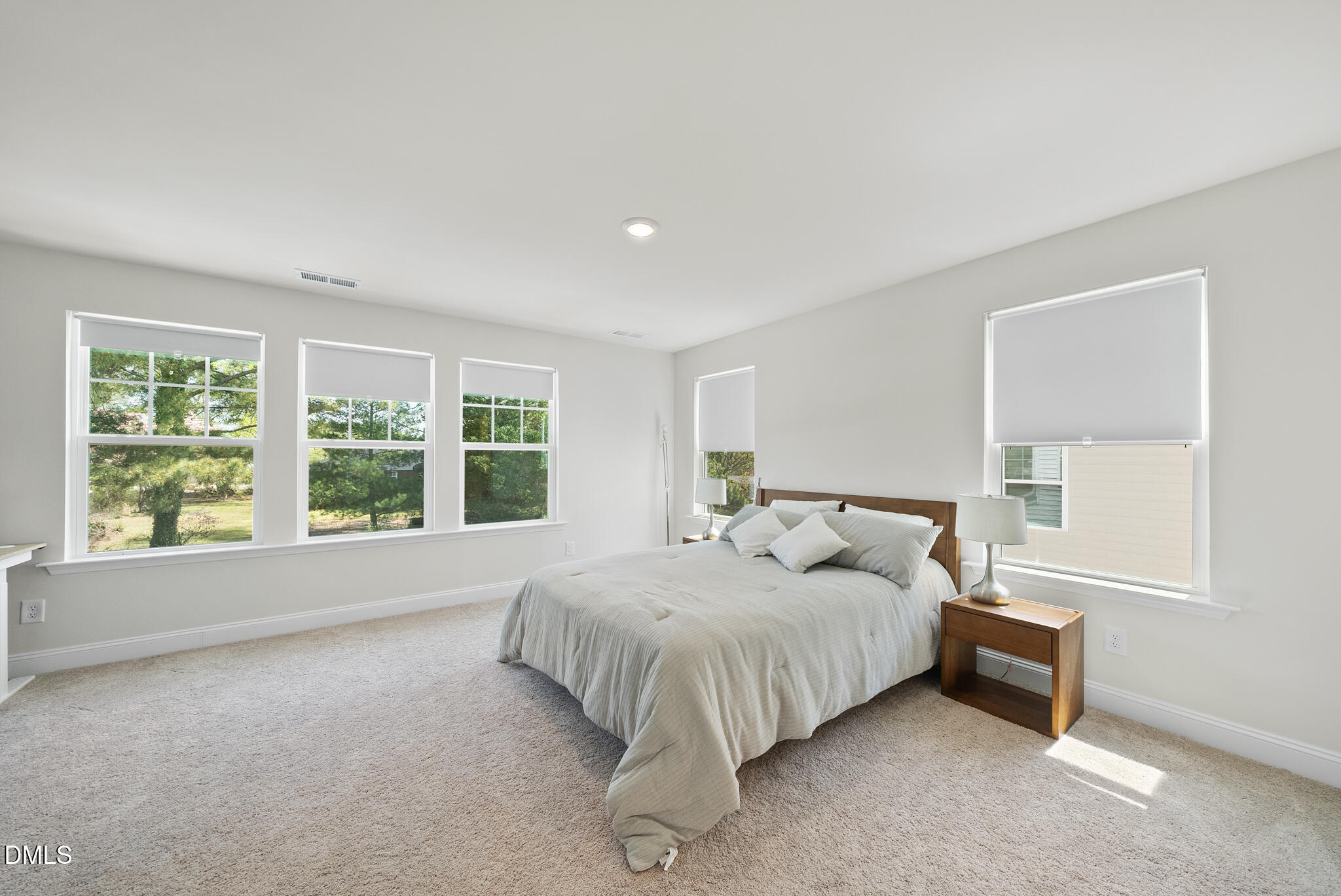 53 Bibury Way Angier, NC 27501 - Photo 24 of 50 a bed sitting in a spacious bedroom next to a window